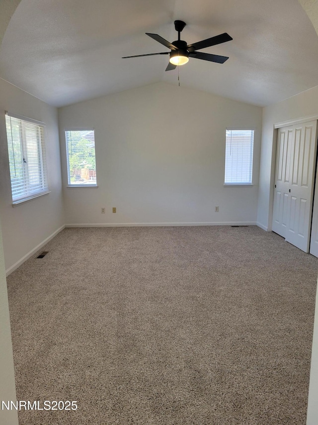 2967 Aspendale Dr, Reno, NV 89503 - spare room with plenty of natural light, ceiling fan, carpet, and lofted ceiling