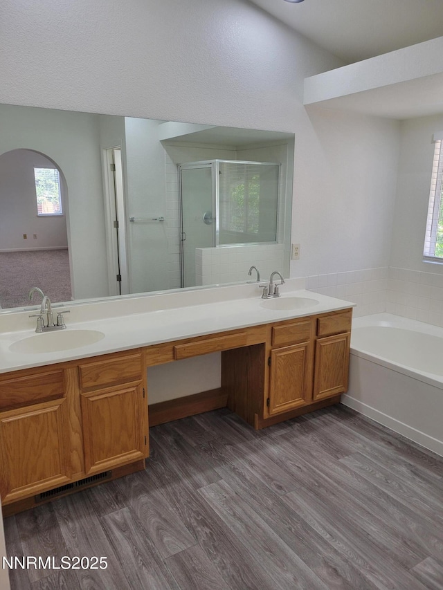 2967 Aspendale Dr, Reno, NV 89503 - full bath with a shower stall, double vanity, wood finished floors, and a garden tub