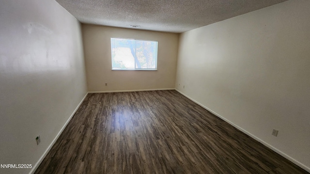 2300 Dickerson Rd Unit 16, Reno, NV 89503 - unfurnished room with dark wood-style flooring and a textured ceiling