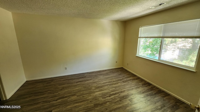 2300 Dickerson Rd Unit 16, Reno, NV 89503 - spare room featuring a textured ceiling and dark wood-type flooring