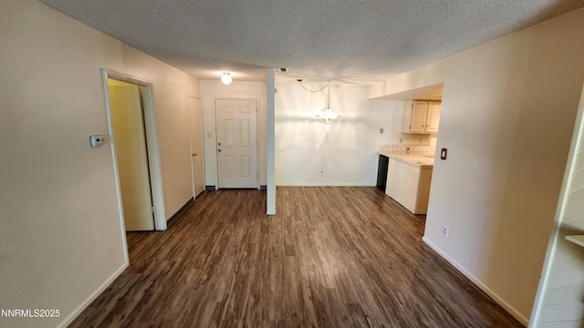 2300 Dickerson Rd Unit 16, Reno, NV 89503 - unfurnished living room with dark wood-style floors and a textured ceiling