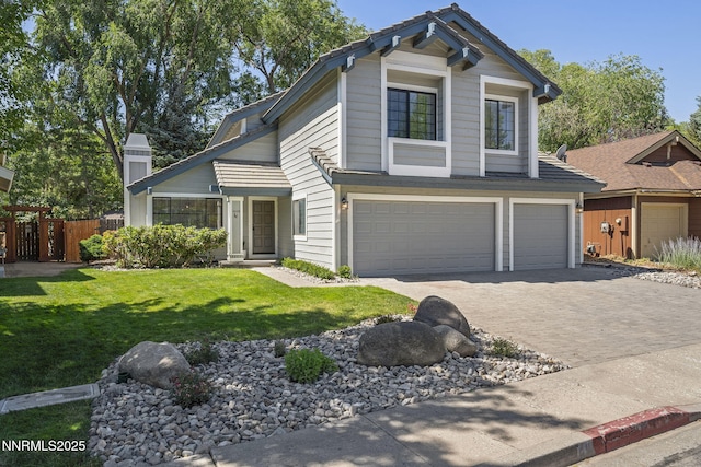4030 Willowsprings Dr, Reno, NV 89519 - view of front of property with an attached garage, driveway, and a chimney