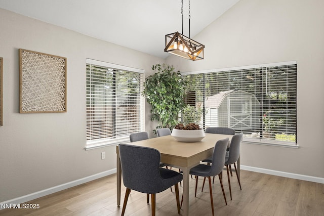 4030 Willowsprings Dr, Reno, NV 89519 - dining area featuring wood finished floors, lofted ceiling, and a chandelier