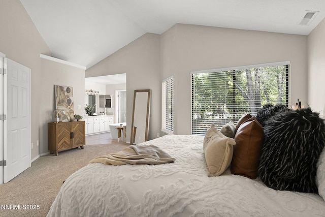 4030 Willowsprings Dr, Reno, NV 89519 - bedroom featuring light carpet, ensuite bathroom, and high vaulted ceiling