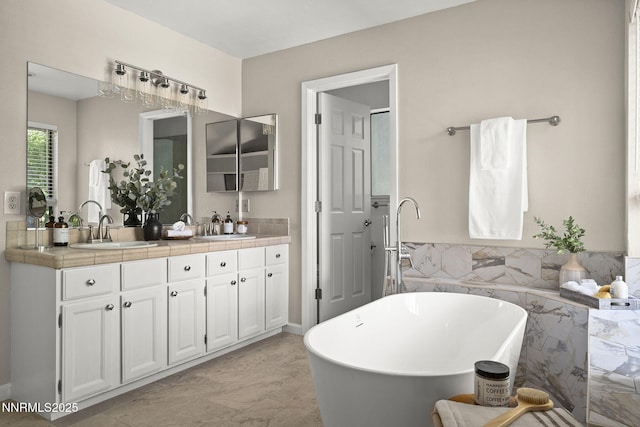4030 Willowsprings Dr, Reno, NV 89519 - bathroom featuring double vanity, a soaking tub, tile walls, and a wainscoted wall