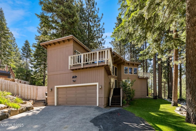 173 Hall Ct, Stateline, NV 89449 - view of front of home with asphalt driveway, a garage, stairway, and a balcony