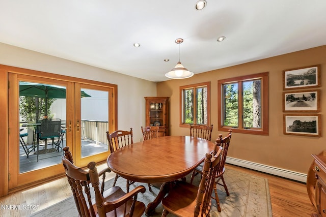 173 Hall Ct, Stateline, NV 89449 - dining room with a baseboard heating unit, light wood finished floors, recessed lighting, and french doors