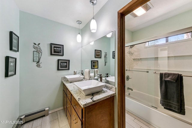 173 Hall Ct, Stateline, NV 89449 - bathroom featuring a baseboard radiator, double vanity, and combined bath / shower with glass door