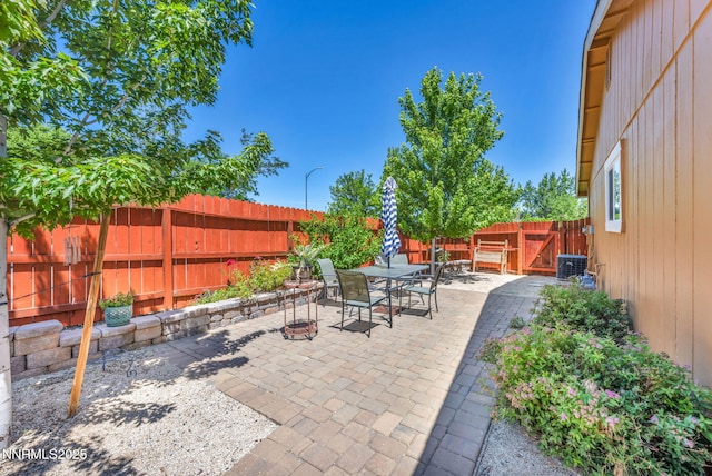 6670 Lotus St, Reno, NV 89506 - fenced backyard with outdoor dining area and a patio area