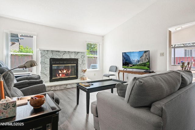 777 W Bonanza Dr, Carson City, NV 89706 - living room with wood finished floors, a fireplace, and lofted ceiling