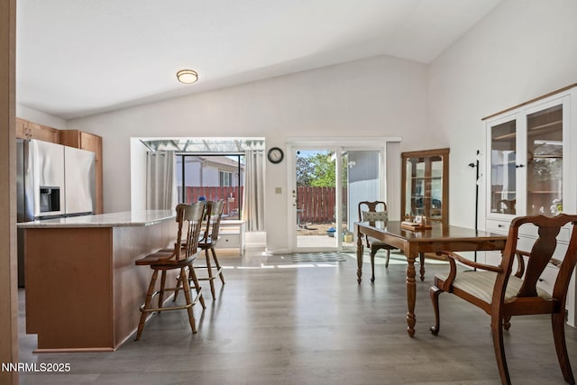 777 W Bonanza Dr, Carson City, NV 89706 - dining area featuring wood finished floors and high vaulted ceiling