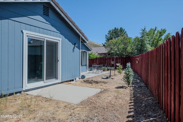 777 W Bonanza Dr, Carson City, NV 89706 - fenced backyard with a patio area