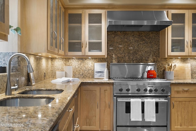 210 Allen Way, Incline Village, NV 89451 - kitchen with high end stainless steel range, wall chimney range hood, decorative backsplash, and glass insert cabinets