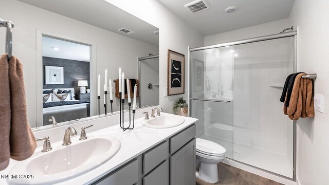 1639 Prancer St Lot # 47, Reno, NV 89523 - ensuite bathroom featuring a stall shower, double vanity, and wood finished floors
