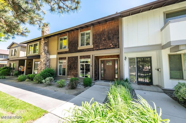 1419 Foster Dr, Reno, NV 89509 - townhome / multi-family property featuring a chimney