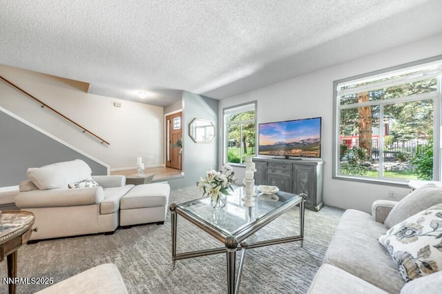 1419 Foster Dr, Reno, NV 89509 - living room featuring a textured ceiling and stairs
