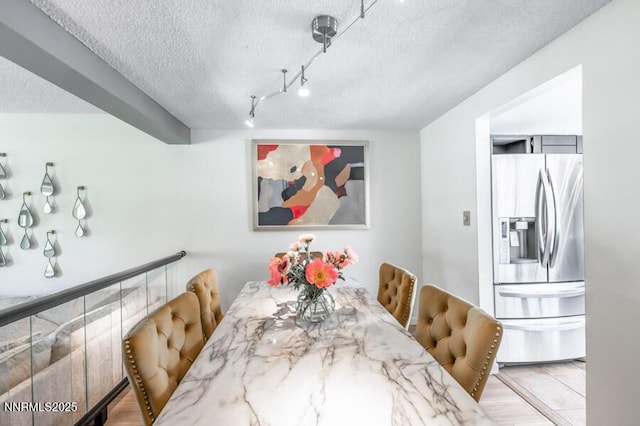 1419 Foster Dr, Reno, NV 89509 - dining space with a textured ceiling and track lighting