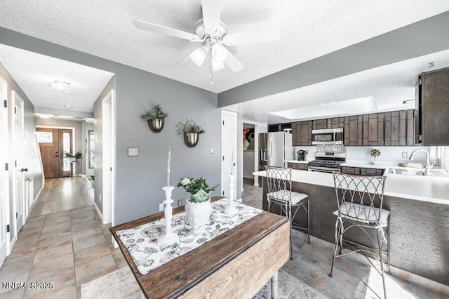 1419 Foster Dr, Reno, NV 89509 - dining space featuring a ceiling fan and a textured ceiling