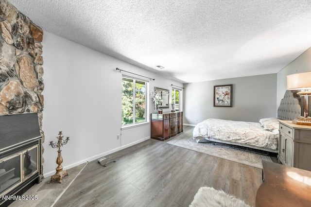 1419 Foster Dr, Reno, NV 89509 - bedroom featuring wood finished floors and a textured ceiling