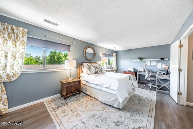 1419 Foster Dr, Reno, NV 89509 - bedroom featuring a textured ceiling, an office area, and wood finished floors