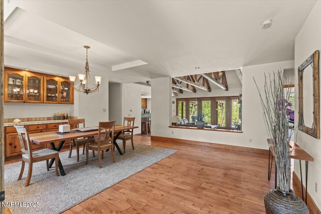 6195 Philoree Ln, Reno, NV 89511 - dining area featuring light wood-style floors and a chandelier