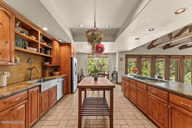 6195 Philoree Ln, Reno, NV 89511 - kitchen with appliances with stainless steel finishes, open shelves, decorative backsplash, a textured ceiling, and recessed lighting