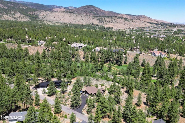 6195 Philoree Ln, Reno, NV 89511 - aerial overview of property's location featuring a mountainous background and a heavily wooded area