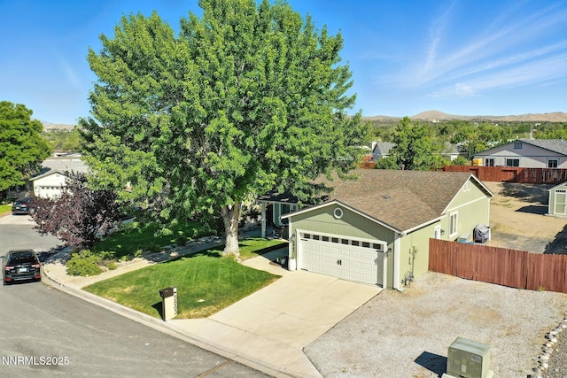 5863 Foggy Ct, Sun Valley, NV 89433 - view of front of home featuring an attached garage, driveway, and a mountain view