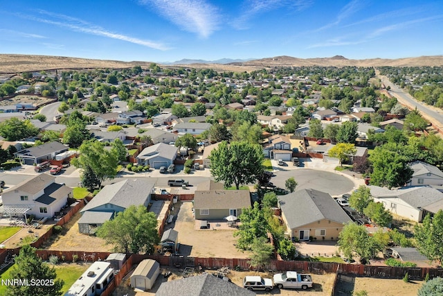 5863 Foggy Ct, Sun Valley, NV 89433 - aerial overview of property's location with nearby suburban area and a mountainous background