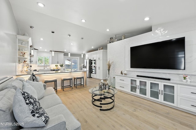 5863 Foggy Ct, Sun Valley, NV 89433 - living area with lofted ceiling, light wood-style floors, and recessed lighting