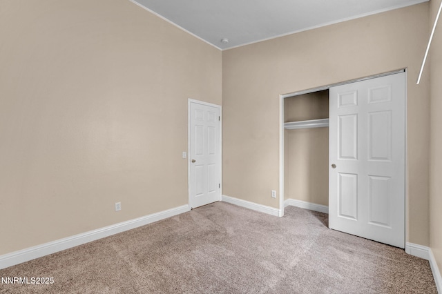 7449 Ambush Cir, Sparks, NV 89436 - unfurnished bedroom featuring carpet flooring, crown molding, and a closet