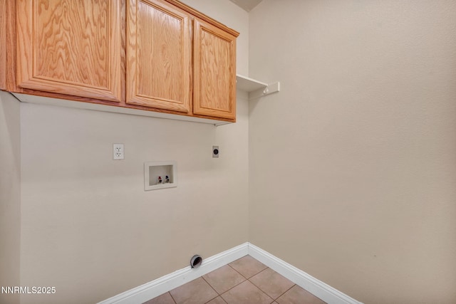 7449 Ambush Cir, Sparks, NV 89436 - laundry area featuring hookup for a washing machine, cabinet space, light tile patterned floors, and electric dryer hookup