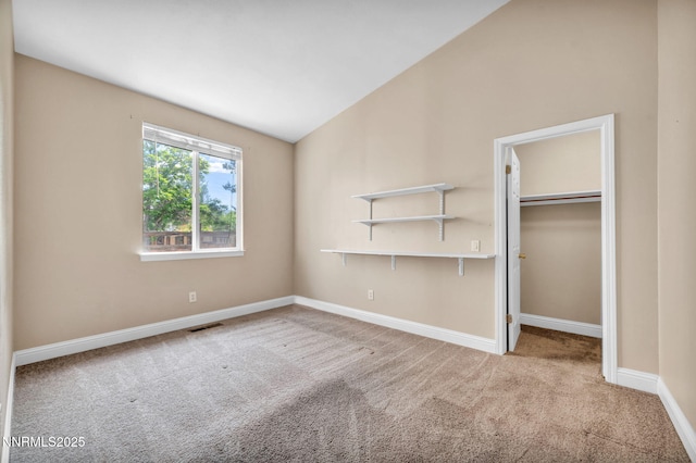 7449 Ambush Cir, Sparks, NV 89436 - unfurnished bedroom featuring carpet floors, vaulted ceiling, a spacious closet, and a closet