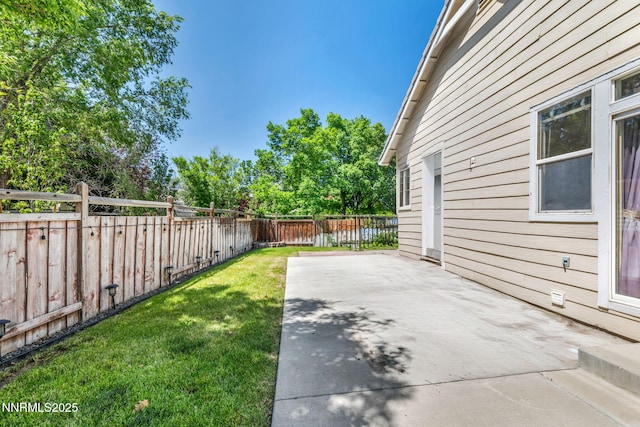 7449 Ambush Cir, Sparks, NV 89436 - fenced backyard with a patio area