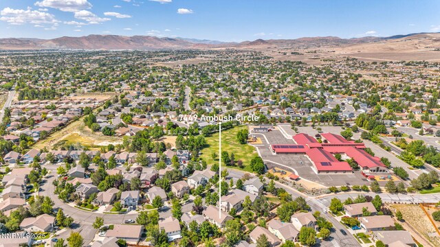 7449 Ambush Cir, Sparks, NV 89436 - aerial perspective of suburban area with a mountainous background