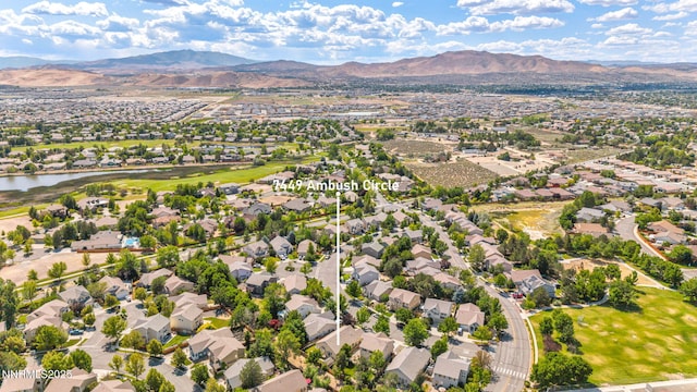 7449 Ambush Cir, Sparks, NV 89436 - aerial overview of property's location featuring nearby suburban area and a water and mountain view