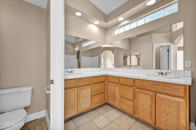 7449 Ambush Cir, Sparks, NV 89436 - bathroom featuring recessed lighting, double vanity, plenty of natural light, and a shower stall