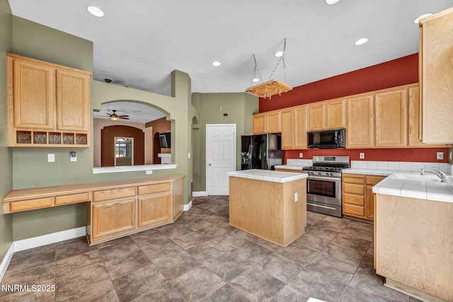 7449 Ambush Cir, Sparks, NV 89436 - kitchen featuring black appliances, light brown cabinets, tile counters, a kitchen island, and recessed lighting