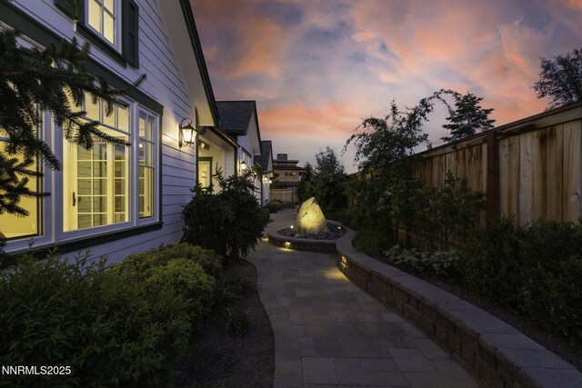 6145 Triple Crown Dr, Reno, NV 89511 - property exterior at dusk featuring a patio