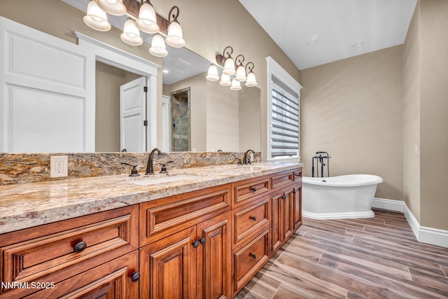 6145 Triple Crown Dr, Reno, NV 89511 - full bath featuring a shower stall, double vanity, a freestanding tub, and wood finished floors