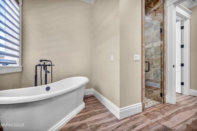 6145 Triple Crown Dr, Reno, NV 89511 - full bath with a stall shower, a freestanding tub, and wood finished floors