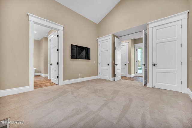 6145 Triple Crown Dr, Reno, NV 89511 - unfurnished bedroom with carpet flooring, lofted ceiling, and two closets