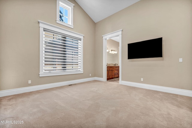 6145 Triple Crown Dr, Reno, NV 89511 - unfurnished room with light carpet, healthy amount of natural light, and high vaulted ceiling