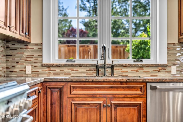 6145 Triple Crown Dr, Reno, NV 89511 - kitchen with dishwasher, backsplash, and brown cabinets
