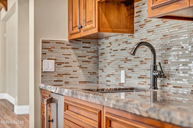 6145 Triple Crown Dr, Reno, NV 89511 - kitchen featuring decorative backsplash, stainless steel countertops, and brown cabinets