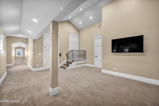6145 Triple Crown Dr, Reno, NV 89511 - unfurnished living room with carpet, vaulted ceiling, stairs, and recessed lighting