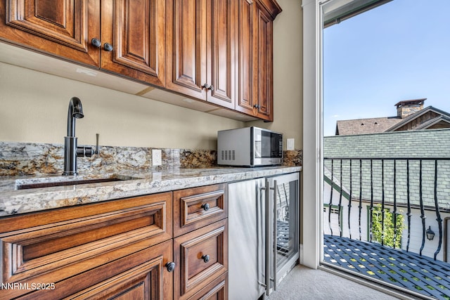 6145 Triple Crown Dr, Reno, NV 89511 - bar area with stainless steel microwave, healthy amount of natural light, carpet flooring, and wine cooler