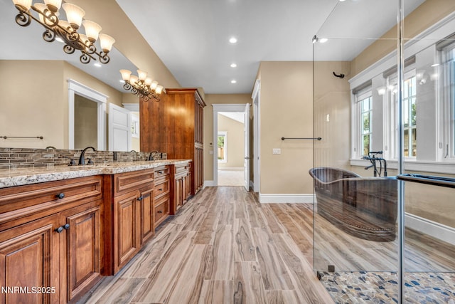 6145 Triple Crown Dr, Reno, NV 89511 - full bathroom with double vanity, wood finished floors, recessed lighting, a chandelier, and a shower