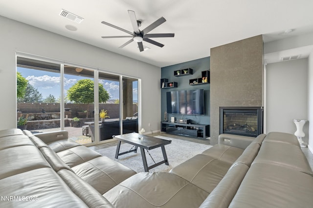 9435 Stony Hill Rd, Reno, NV 89521 - living area featuring a ceiling fan, a tile fireplace, and wood finished floors