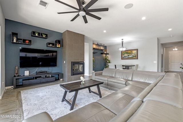 9435 Stony Hill Rd, Reno, NV 89521 - living area with a ceiling fan, wood finished floors, recessed lighting, and a tiled fireplace